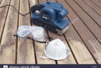 Belt Sander On Partially Sanded Wooden Decking During Renovation pertaining to dimensions 1300 X 956