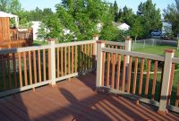 Ultradeck Natural Composite Decking: A close-up view of a beautiful and natural-looking deck made from a blend of wood fibers and recycled plastic. The decking material is designed to be durable and resistant to fading, staining, and mold growth.
