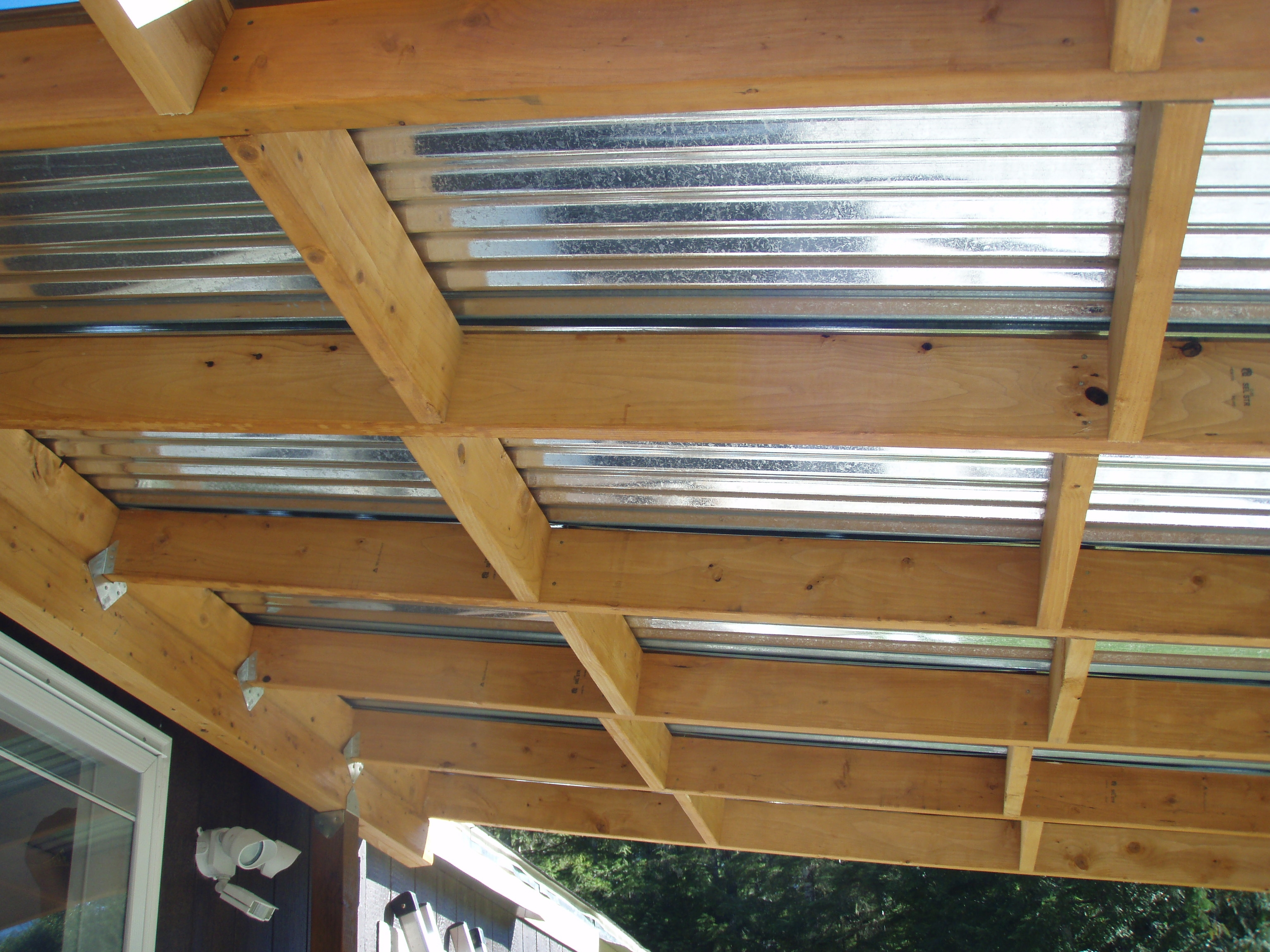 corrugated metal roofing under deck • decks ideas